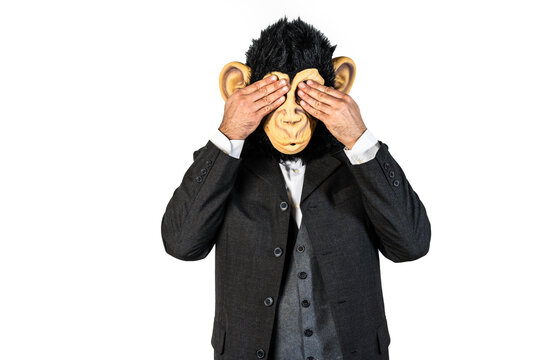 Monkey man hiding his eyes with the hands in a shy gesture