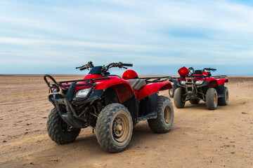 Quad bike tour. Red quadricycles in the desert. Explore Egypt © Anastasika