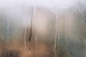 Background, texture of a drop of water, streaks and rain on glass, window. Photography, abstraction.