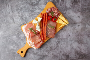 Mixed delicatessen with charcuterie and cheese board with a place for text.  Space for banner,...