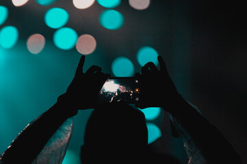 cheering crowd with raised hands at concert - music festival