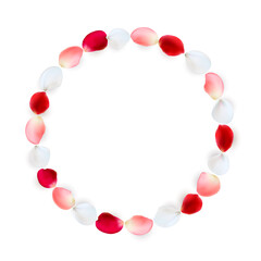 Round frame made of rose petals. White, red and pink petals arranged in a circle.