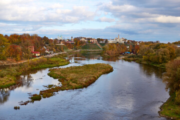 Fototapeta na wymiar Grodno, Belarus, panoramic view of the Neman River old and new castles in autumn