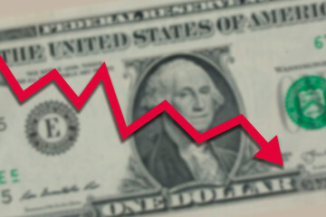 Blurred one US dollar bill with red stock market chart arrow going down. Dollar exchange rate going down concept. - 503558826