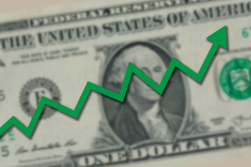 Blurred one US dollar bill with green stock market chart arrow going up. Dollar exchange rate going up concept.