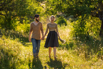 Fototapeta premium happy young couple walking in nature