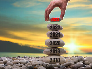 Happy new year 2023 concept. Entering the year 2023. Years ( 2018-2019-2020-2021-2022 ) written on...