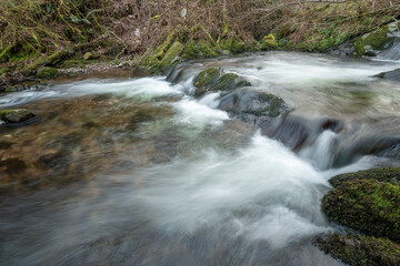 Long exposure of a waterfall on the river Horner in Horner woods in Somerset