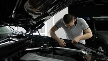 Repairman - auto mechanic, works in a car repair shop. Installation of parts under the hood. The...