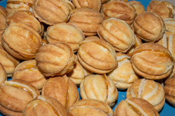 Nuts in the shape of a sweet cookie, nutrition concept. Nuts for baking. Sweet nuts with condensed milk. Sweet pastry in the form of a nut. Homemade cookies.
