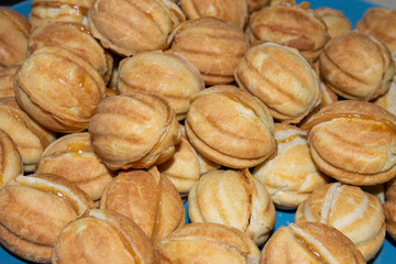 Nuts in the shape of a sweet cookie, nutrition concept. Nuts for baking. Sweet nuts with condensed milk. Sweet pastry in the form of a nut. Homemade cookies.