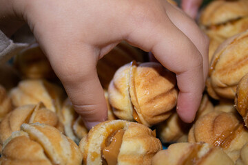 Nuts in the shape of a sweet cookie, nutrition concept. Nuts for baking. Sweet nuts with condensed milk. Sweet pastry in the form of a nut. Homemade cookies.