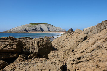 Cliffs next to a turquoise blue sea