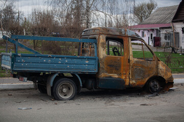 Burnt car after shelling by Russian military
