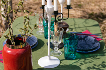a table set in nature at the dacha in spring for lunch or dinner
