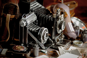 Old camera on wooden background