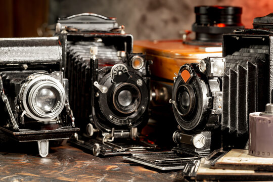 Old vintage cameras on an old background.