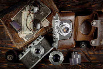Old vintage cameras on an old background.