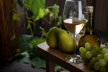 Cheese board with grapes and white wine