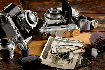 Old vintage cameras on an old background.