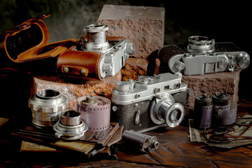 Old camera on wooden background