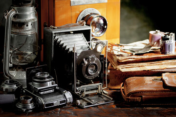 Old camera in the studio on an old background
