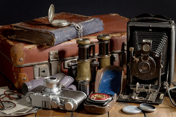 Old camera in the studio on an old background
