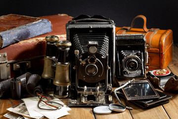 Old vintage cameras on an old background.