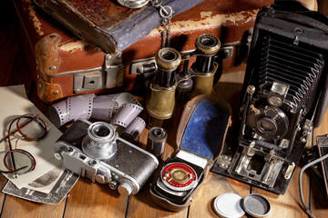 Old vintage cameras on an old background.