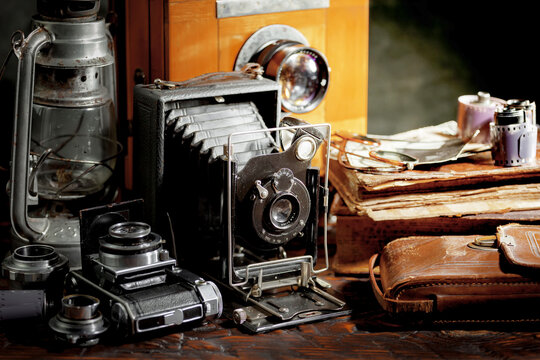 Old camera in the studio on an old background