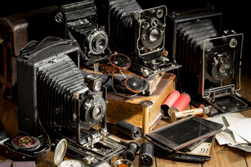 Old camera in the studio on an old background