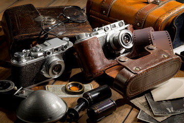 Old vintage cameras on an old background.
