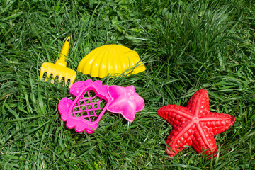 Children's sandbox. Sandbox molds. Children play in the sandbox. Sand on the playground.