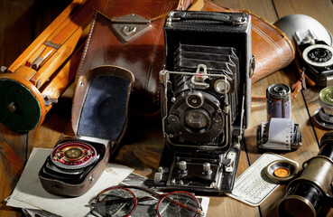 Old camera in the studio on an old background