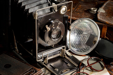 Old vintage photo cameras on an old background.