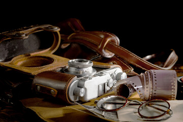 Old vintage photo cameras on an old background.