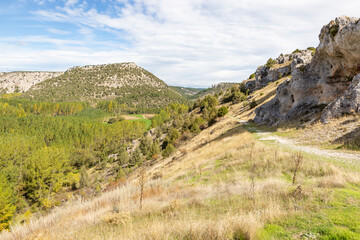 Senda del Castillo PRCSO66 pedestrian path with a view to the Alto de La Galiana next to the castle of Ucero, province of Soria, Castile and Leon, Spain