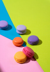 Multi-colored pasta on a multi-colored bright background. Place for text