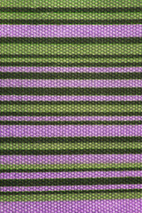 close up of the stripped lilac and green fabric texture background