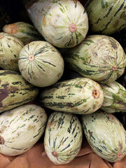 zucchini stacked at the market