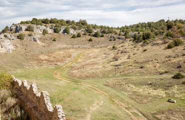 hiking trail in front of the Castle of Ucero, province of Soria, Castile and Leon, Spain