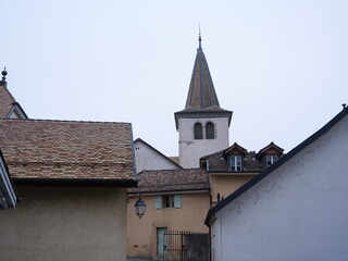 Fototapeta na wymiar The spire of the church of Perroy. Switzerland.