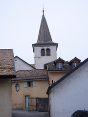 Fototapeta na wymiar The spire of the church of Perroy. Switzerland.