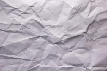 Fototapeta premium White crumpled paper as background texture. Recycling concept