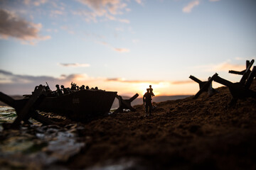 World War 2 reenactment (D-day). Creative decoration with toy soldiers, landing crafts and...