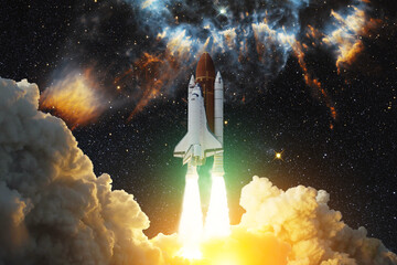 Spaceship flight. Space shuttle with smoke and blast takes off into the starry sky and clouds of gas or dust in space. Rocket starts into nebula. Concept. Elements of this image furnished by NASA.