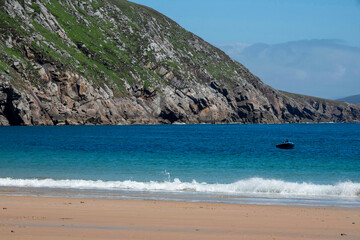 Beautiful sandy Keem beach in Achill island, county Mayo, Ireland. Warm sunny day. Popular travel...