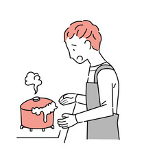 キッチンで鍋が吹きこぼれた男性