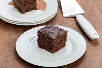 slice of chocolate cake covered with chocolate, served chilled,