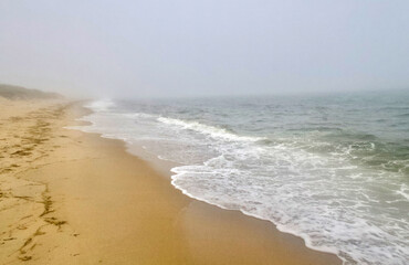 Fototapeta na wymiar Foggy Day at Chatham, Cape Cod on Hardings Beach
